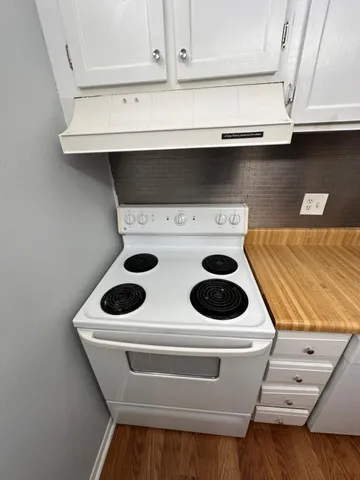 a bathroom with a stove and a microwave