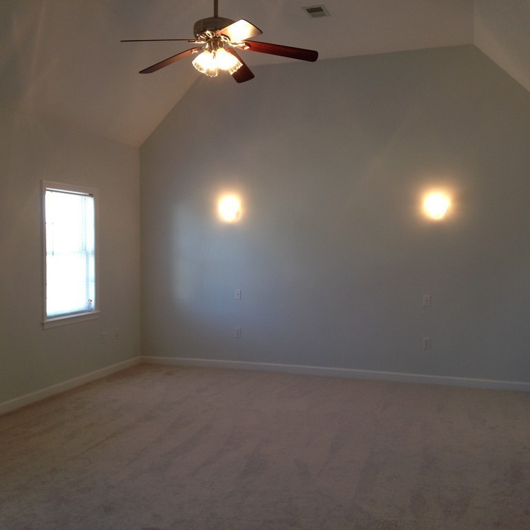 48 Independence Lane Ashland, MA 01721 - Photo 16 of 30 en empty room with windows and chandelier fan