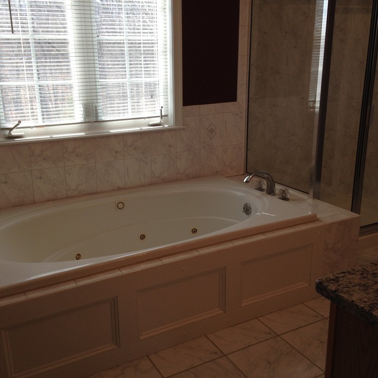 48 Independence Lane Ashland, MA 01721 - Photo 18 of 30 a bathroom with a bathtub and next to a window