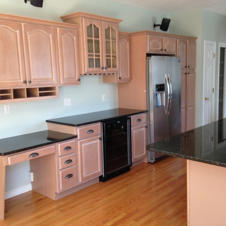 48 Independence Lane Ashland, MA 01721 - Photo 10 of 30 a kitchen with stainless steel appliances a refrigerator and a stove