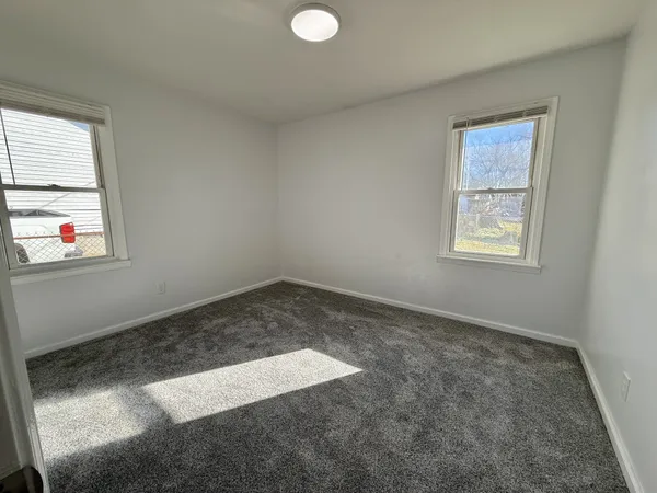 an empty room with windows