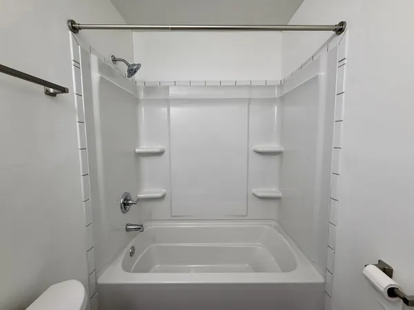 a close view of a bathtub in bathroom