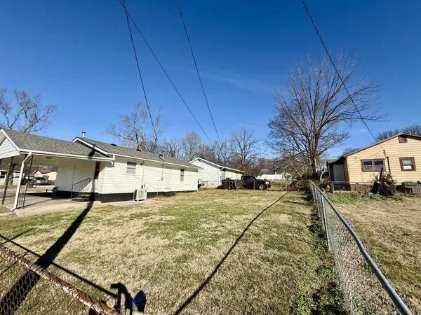 a view of a backyard with a patio