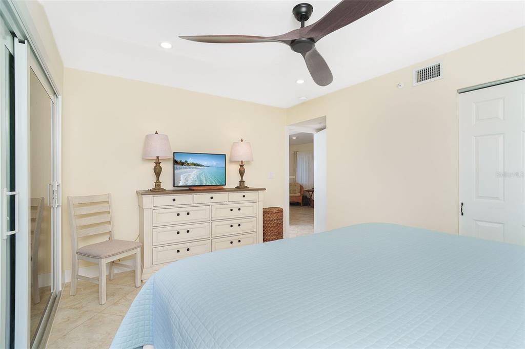 9200 Little Gasparilla, Unit 403 Boca Grande, FL 33921 - Photo 16 of 38 a bedroom with a bed and a dresser