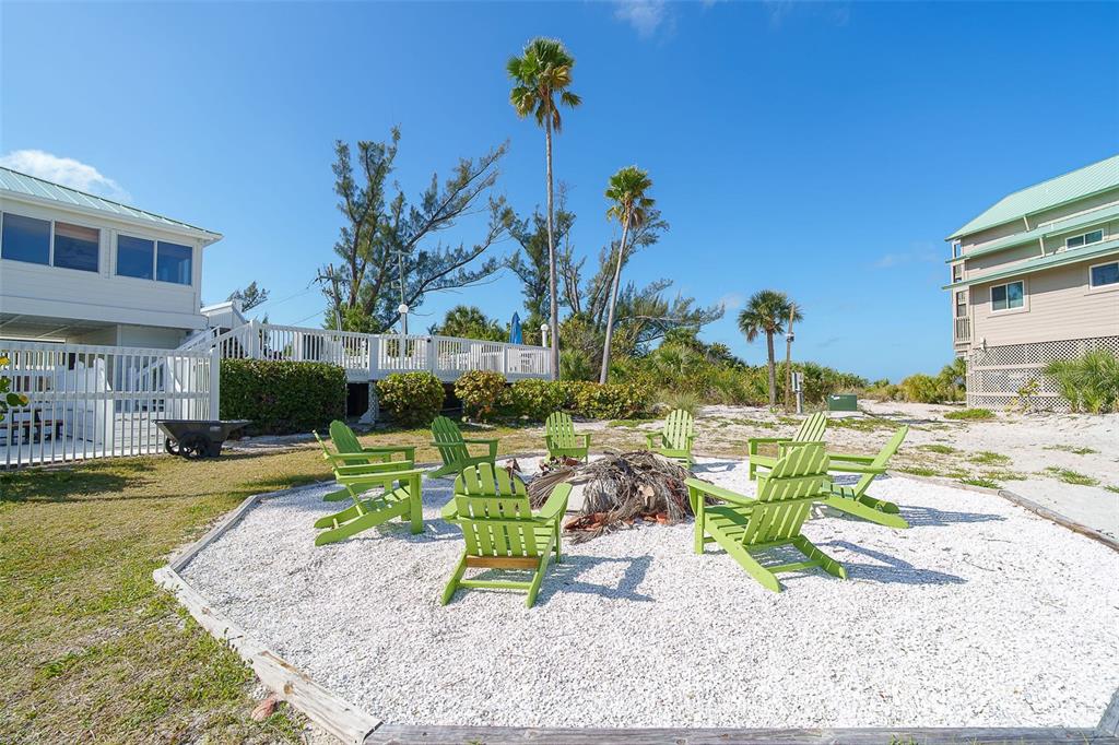 9200 Little Gasparilla, Unit 403 Boca Grande, FL 33921 - Photo 25 of 38 a view of a swimming pool with a patio