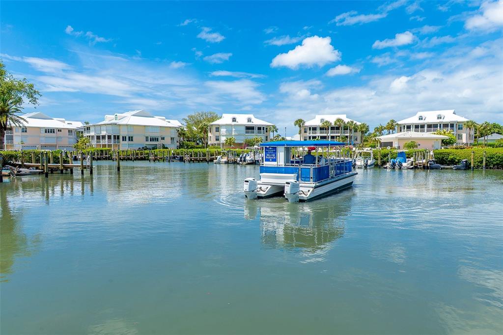 9200 Little Gasparilla, Unit 403 Boca Grande, FL 33921 - Photo 35 of 38 a view of swimming pool with outdoor seating space