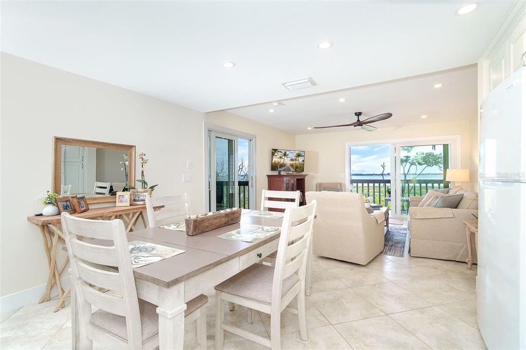 9200 Little Gasparilla, Unit 403 Boca Grande, FL 33921 - Photo 4 of 38 a view of a dining room with furniture window and outside view