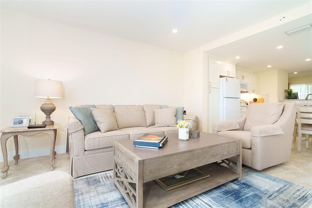 9200 Little Gasparilla, Unit 403 Boca Grande, FL 33921 - Photo 5 of 38 a living room with furniture and a table