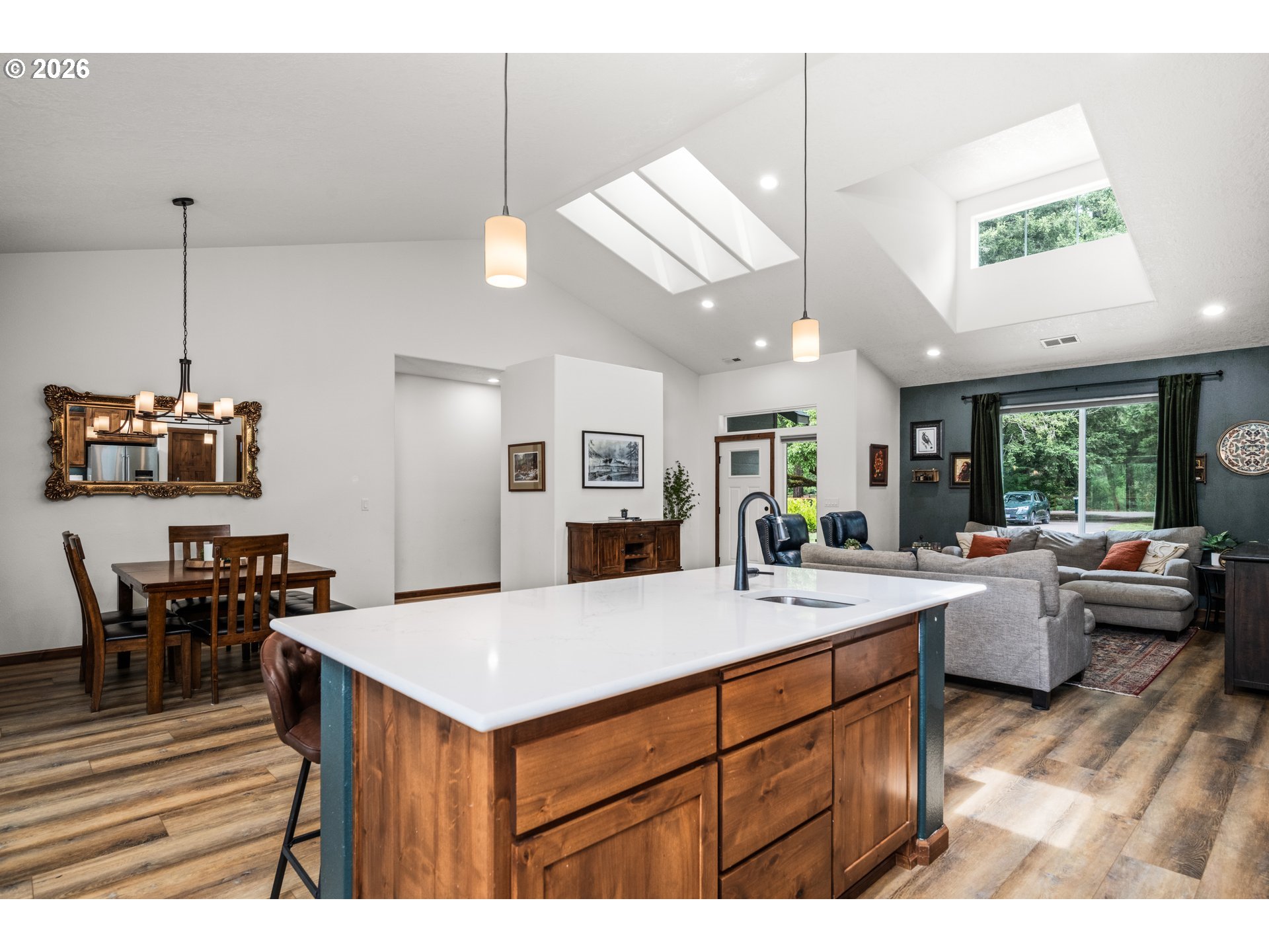 45542 South Gate Creek Road Vida, OR 97488 - Photo 31 of 46 a view of kitchen island kitchen island dining table and chairs