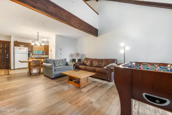 a living room with furniture and a table