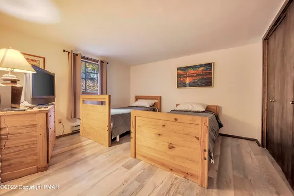 a room with furniture and a flat screen tv
