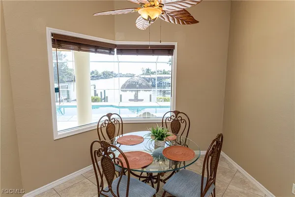 a view of a dining room with furniture window and outside view