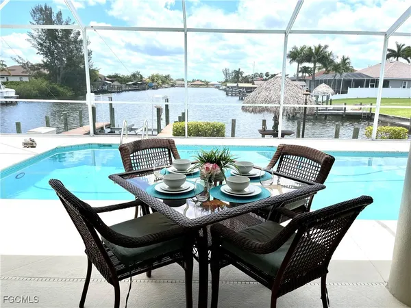 a view of a patio with furniture and outdoor view