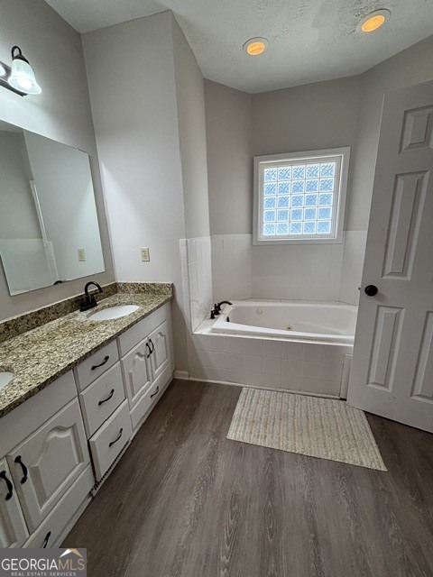 771 Hamilton Road Concord, GA 30206 - Photo 20 of 30 a bathroom with a granite countertop double vanity sink a mirror and a bathtub