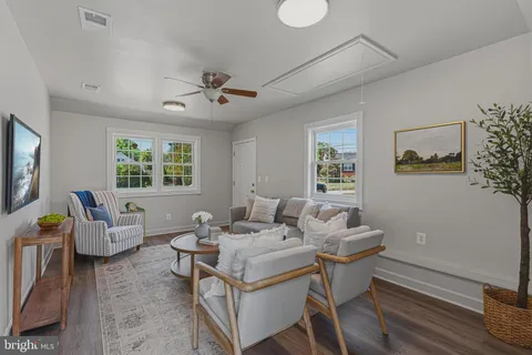 a living room with furniture and a window