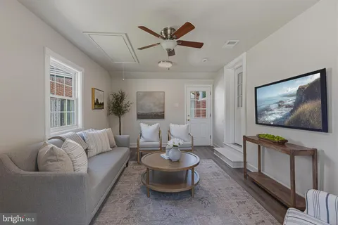 a living room with furniture and window