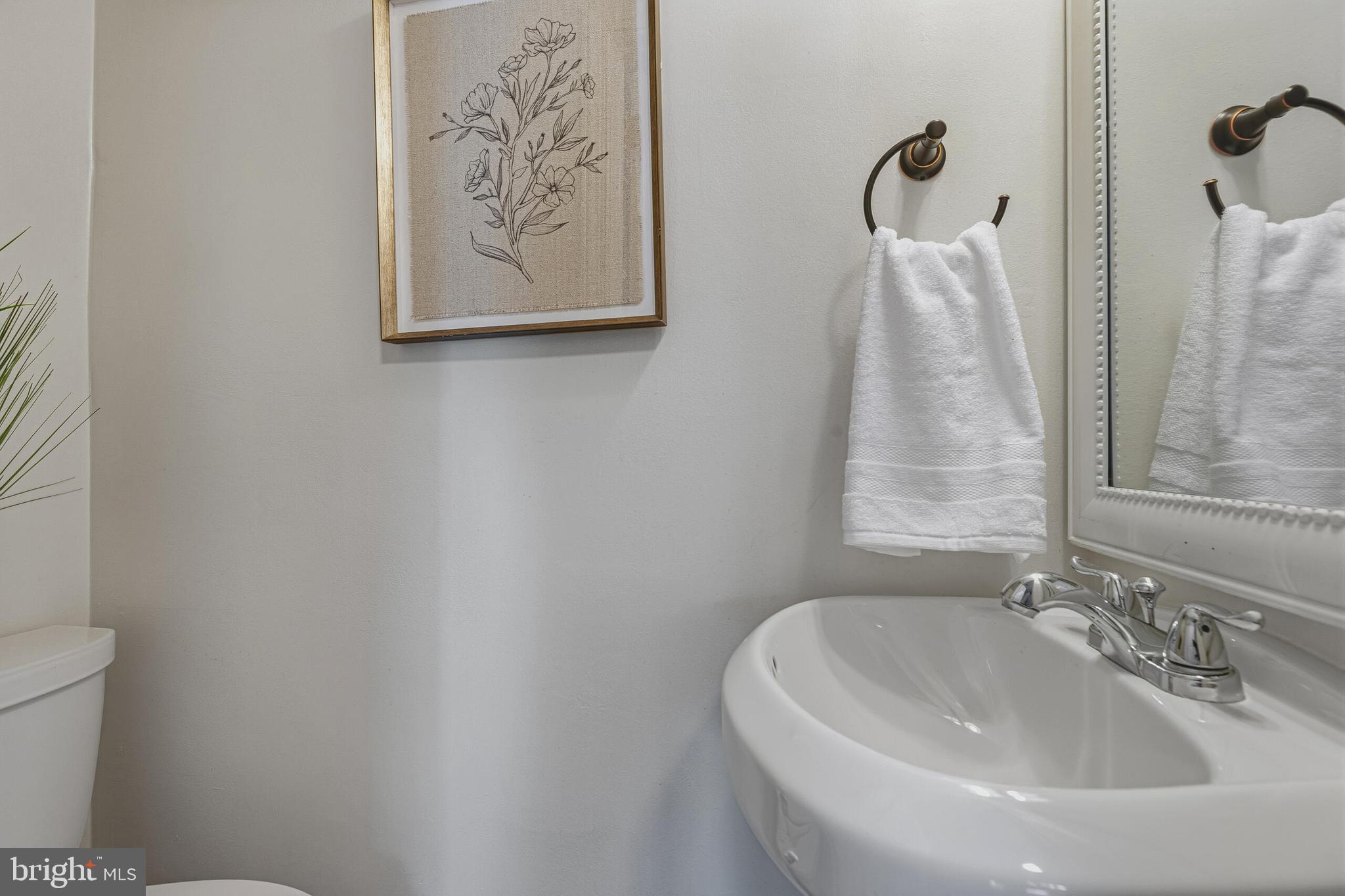 5917 Flanders Street Springfield, VA 22150 - Photo 18 of 40 a bathroom with a sink and a toilet