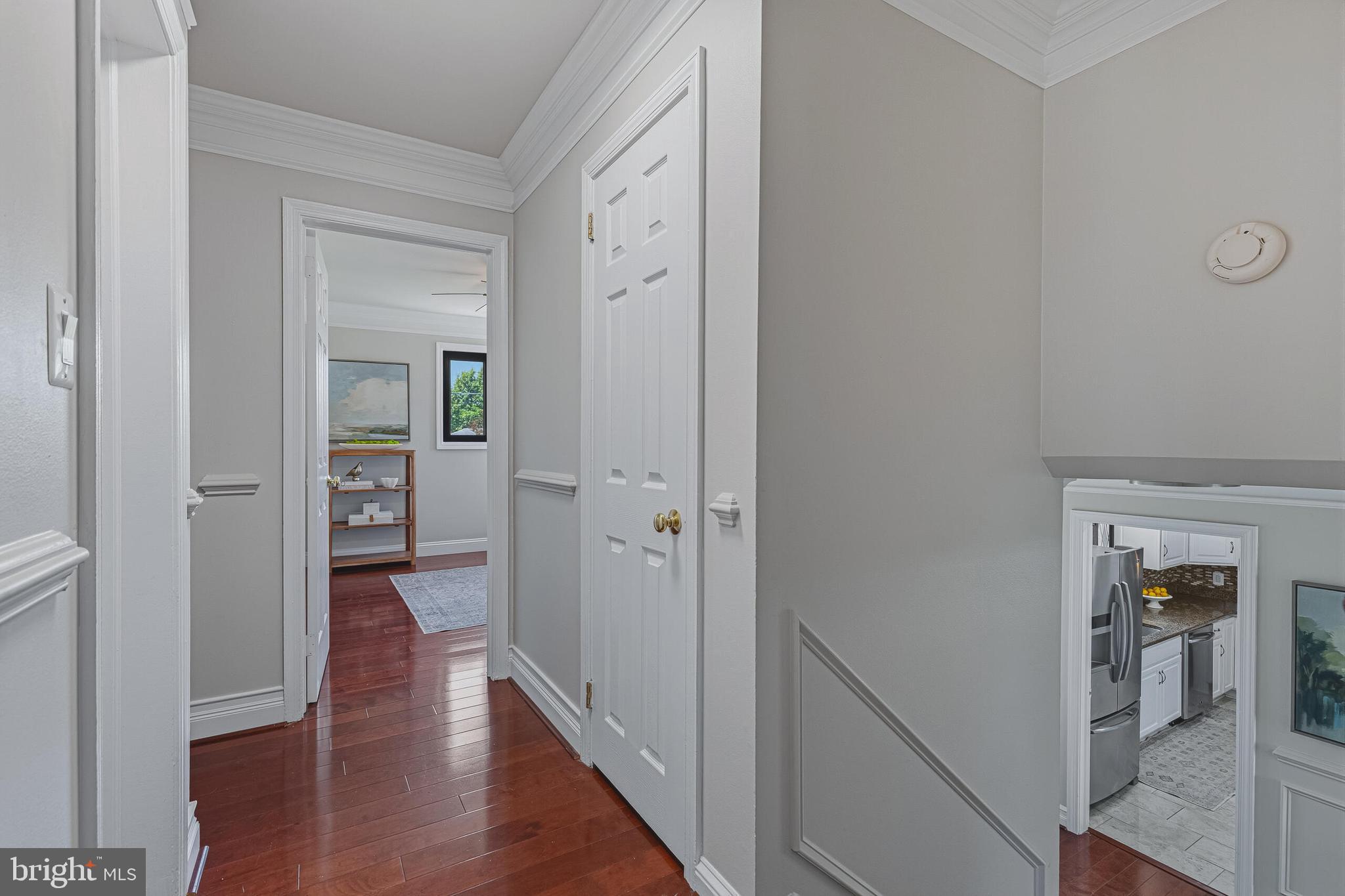 5917 Flanders Street Springfield, VA 22150 - Photo 25 of 40 a view of a hallway with wooden floor