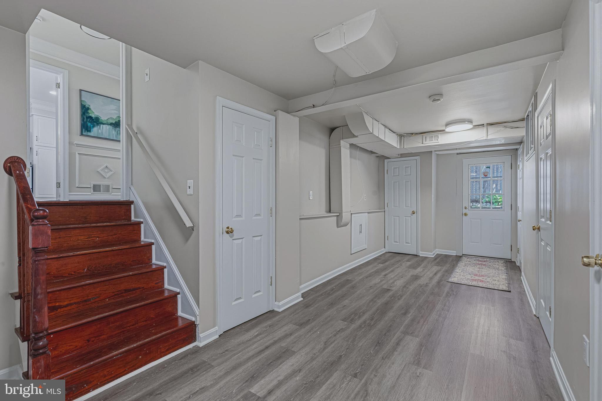 5917 Flanders Street Springfield, VA 22150 - Photo 26 of 40 a view of an entryway with wooden floor