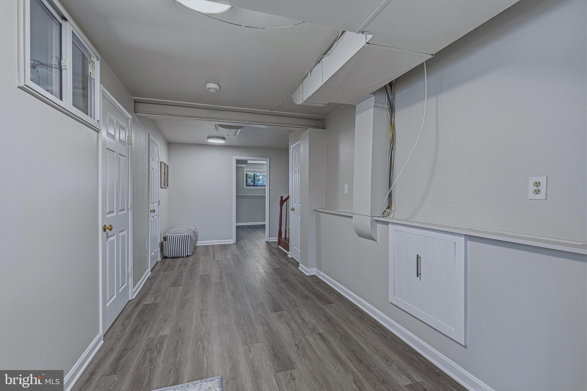 5917 Flanders Street Springfield, VA 22150 - Photo 27 of 40 a view of a hallway with wooden floor