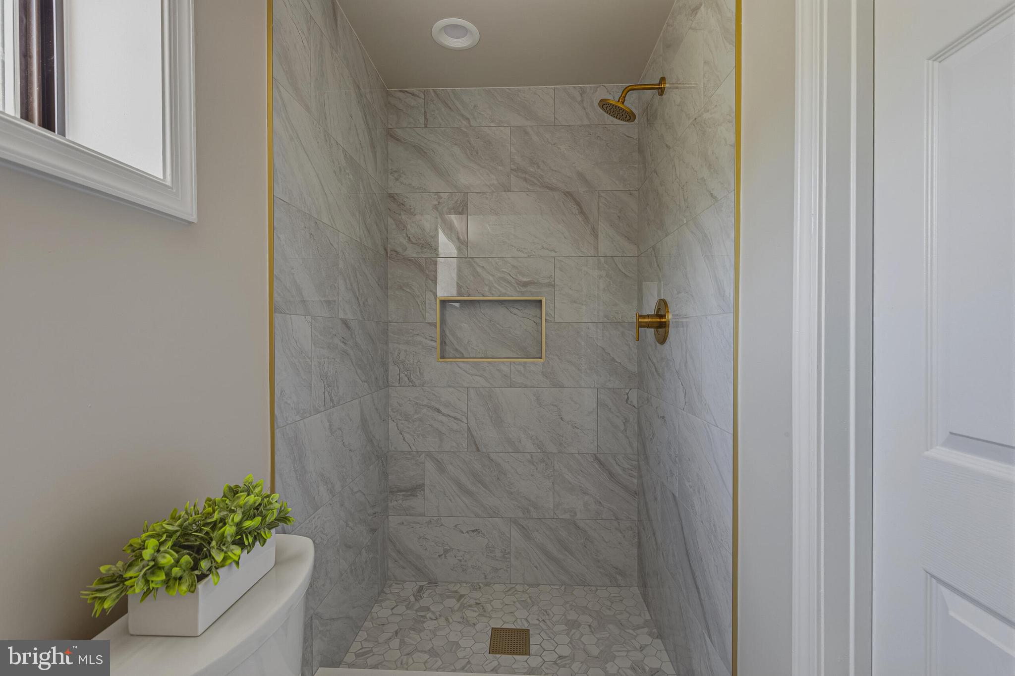 5917 Flanders Street Springfield, VA 22150 - Photo 29 of 40 a bathroom with a shower