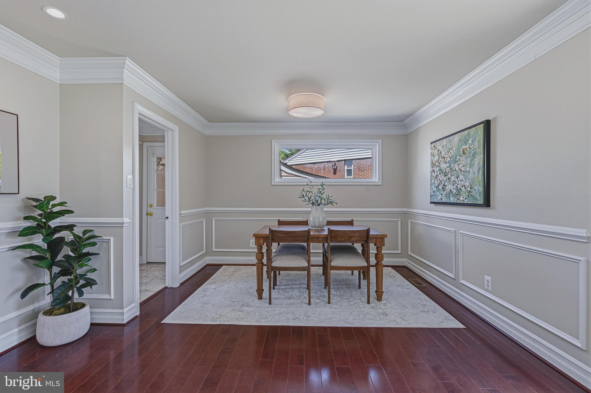 5917 Flanders Street Springfield, VA 22150 - Photo 10 of 40 a view of a dining room with furniture window and wooden floor