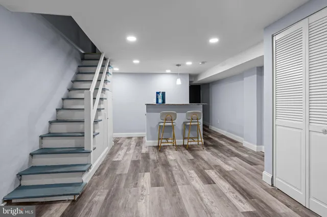 a view of kitchen and hall with wooden floor
