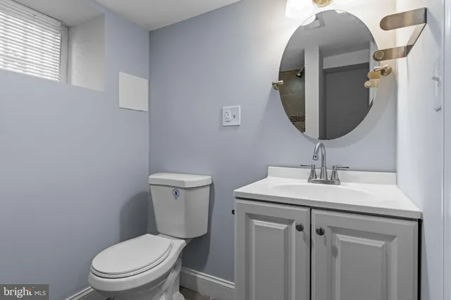 a bathroom with a toilet and sink
