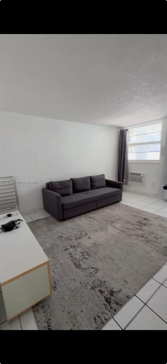 335 Collins Avenue, Unit 302 Miami Beach, FL 33139 - Photo 3 of 19 a living room with furniture