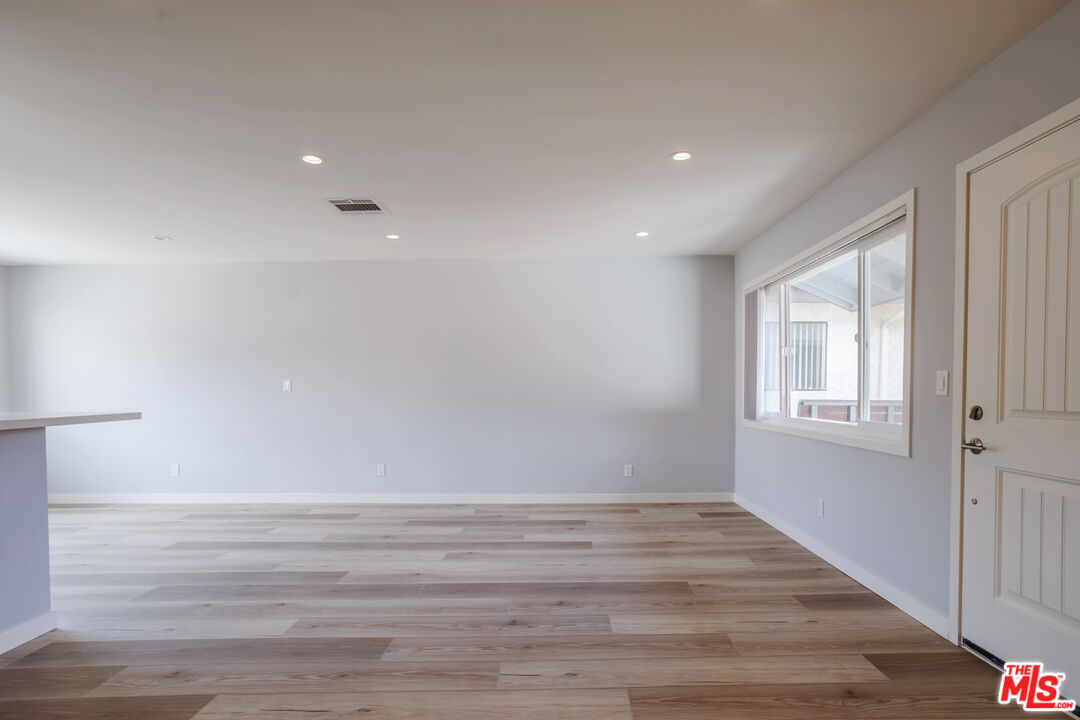 1116 San Rafael Avenue, Unit 6 Glendale, CA 91202 - Photo 11 of 23 a view of room with window and wooden floor