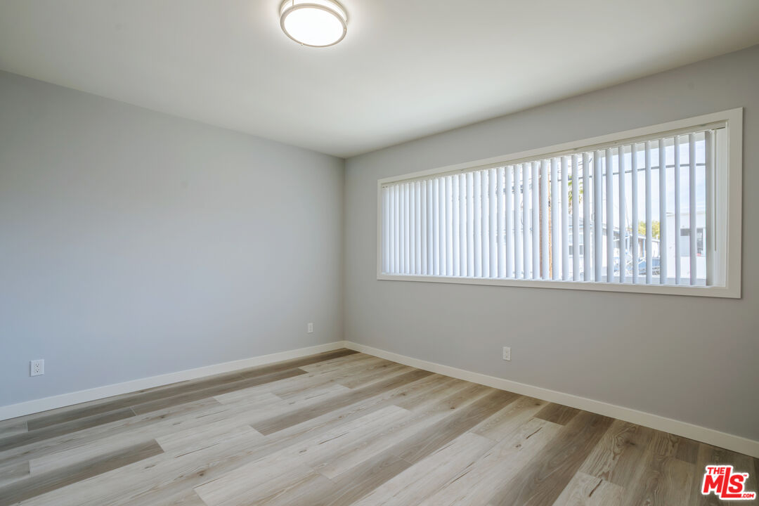 1116 San Rafael Avenue, Unit 6 Glendale, CA 91202 - Photo 13 of 23 wooden floor in an empty room with a window