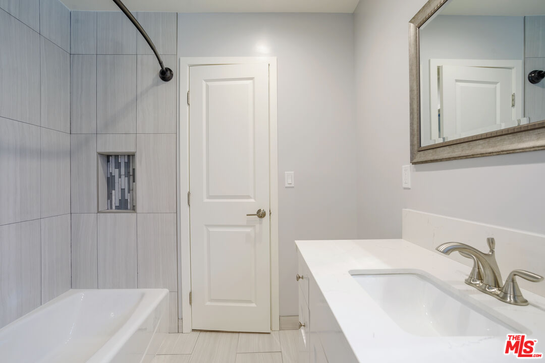 1116 San Rafael Avenue, Unit 6 Glendale, CA 91202 - Photo 22 of 23 a bathroom with a sink a toilet and shower