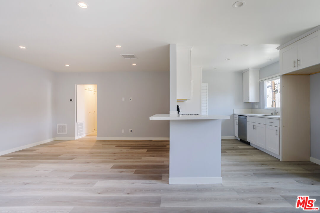 1116 San Rafael Avenue, Unit 6 Glendale, CA 91202 - Photo 6 of 23 a view of kitchen with stainless steel appliances cabinets and wooden floor