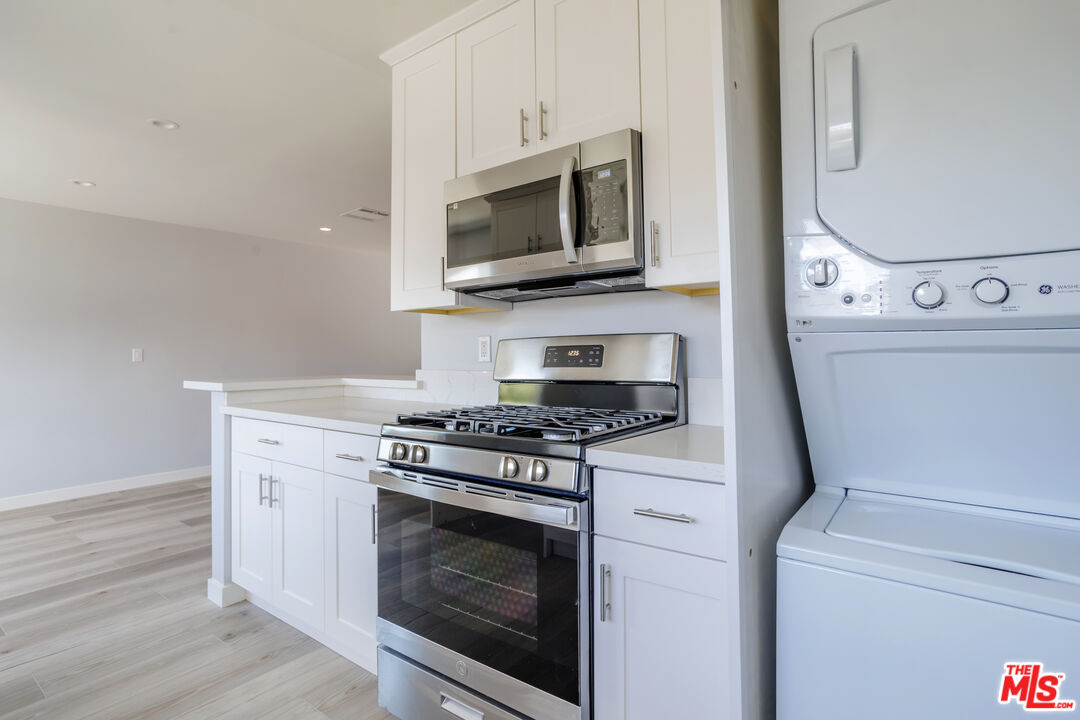 1116 San Rafael Avenue, Unit 6 Glendale, CA 91202 - Photo 8 of 23 a kitchen with a stove and a microwave