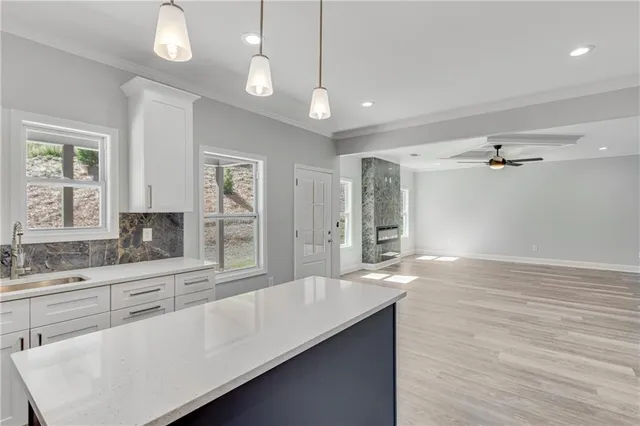 a kitchen with white cabinets and white appliances