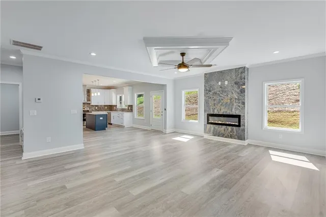 a dining room with furniture a chandelier and wooden floor