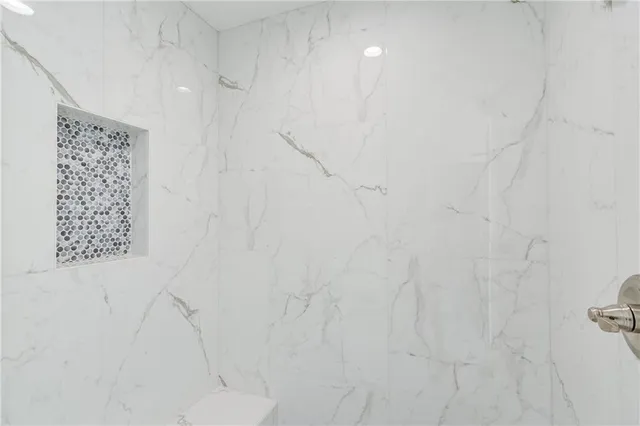 a view of a porch with a table and chairs