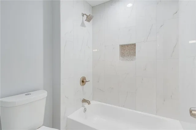 an aerial view of a swimming pool patio and outdoor seating