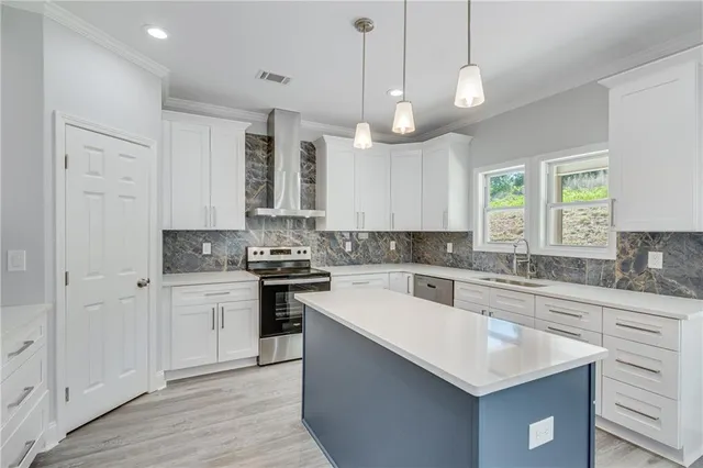 a large kitchen with stainless steel appliances granite countertop a large stove a sink dishwasher and a refrigerator