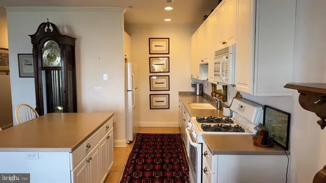a kitchen with a stove and a refrigerator