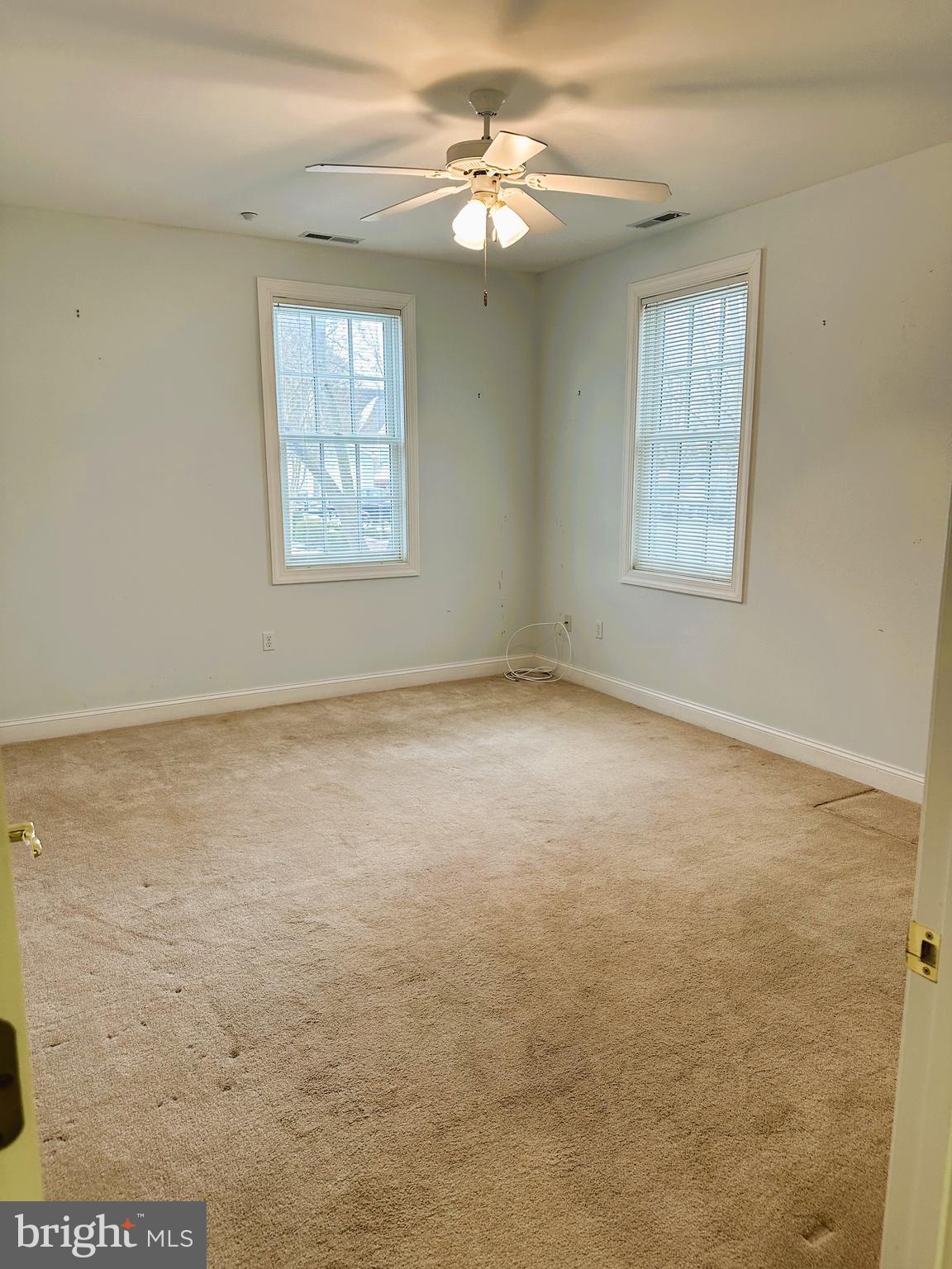 5 Oakley Street, Unit 102 Cambridge, MD 21613 - Photo 13 of 35 Primary Bedroom with lots of natural light