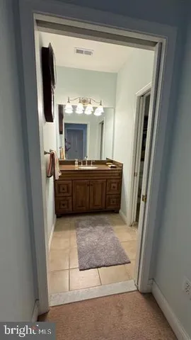 a bedroom with a bed a desk and chair