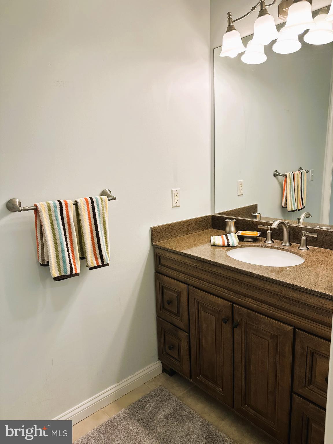 5 Oakley Street, Unit 102 Cambridge, MD 21613 - Photo 14 of 35 Primary full bathroom with linen closet