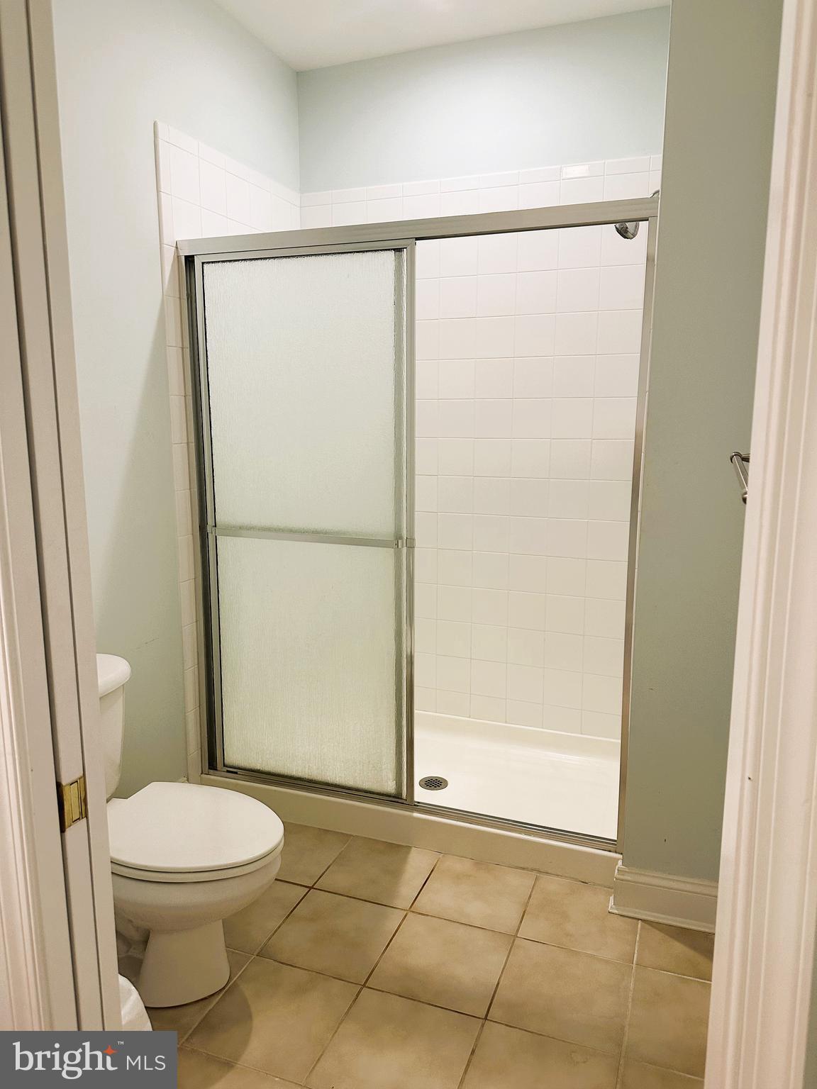 5 Oakley Street, Unit 102 Cambridge, MD 21613 - Photo 16 of 35 Ceramic tile walk in primary shower