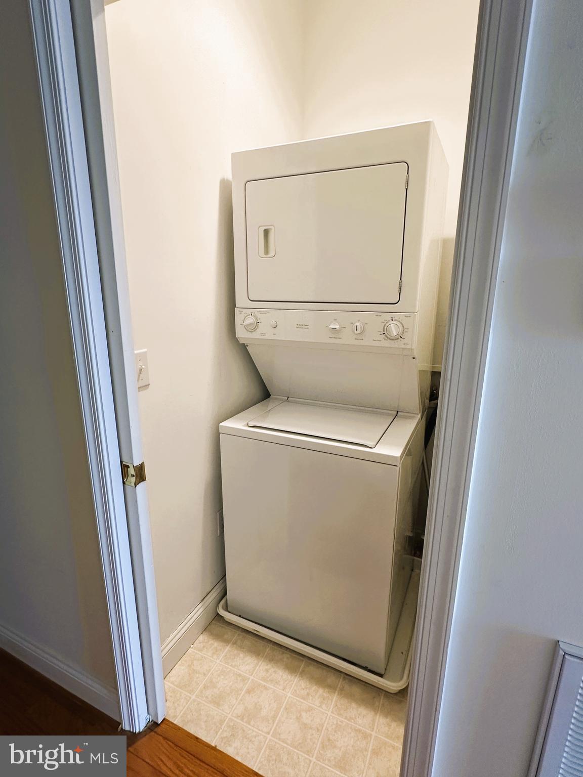5 Oakley Street, Unit 102 Cambridge, MD 21613 - Photo 21 of 35 Stack washer/dryer within pocket door