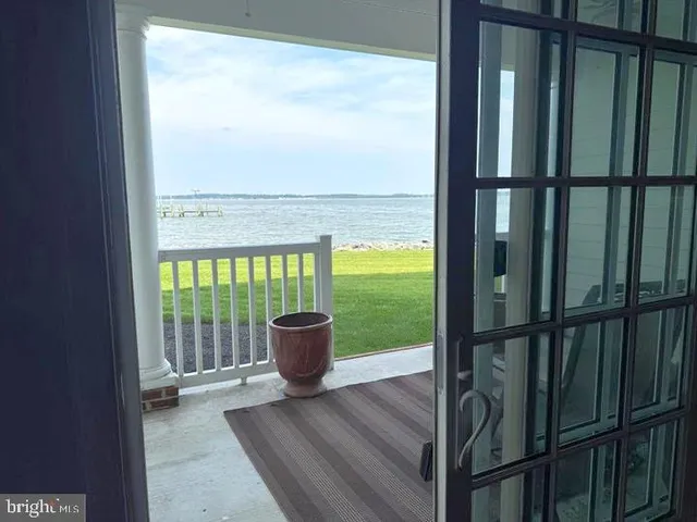 a view of a room with wooden floor and chair