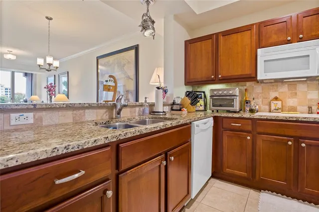 a bed room with a bed window and a ceiling fan