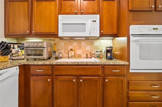 a large bed sitting in a bedroom next to a window