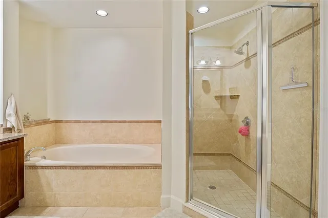 a living room with patio furniture and a floor to ceiling window