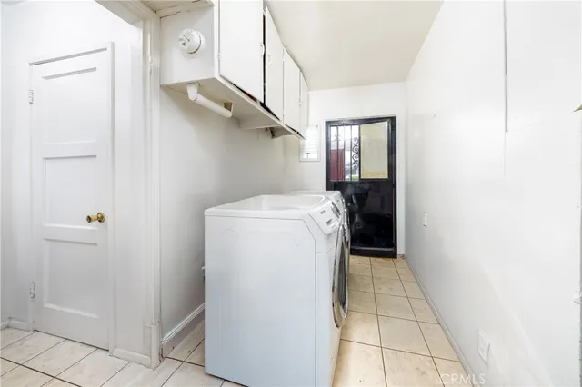 a utility room with cabinets